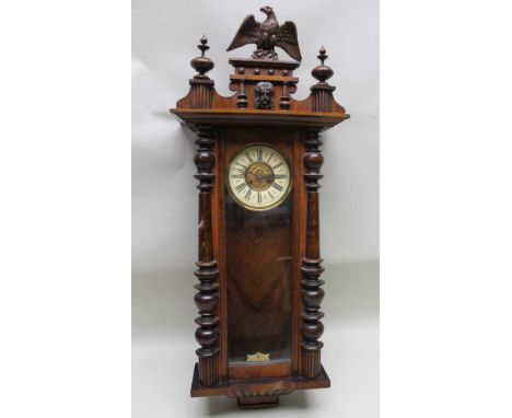 A LATE 19TH CENTURY MAHOGANY FINISHED VIENNESE DESIGN HANGING WALL CLOCK with architectural design pediment and case, complet