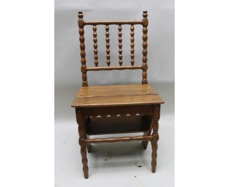 AN ARTS & CRAFTS DESIGN OAK SET OF METAMORPHIC LIBRARY STEPS, having bobbin turned and blocked frame, over plank seat and tre