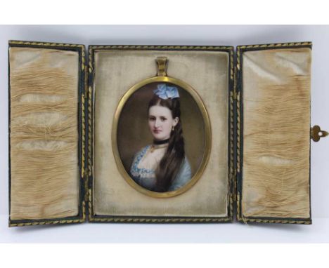 A LATE VICTORIAN HAND COLOURED PHOTOGRAPH, PORTRAIT OF A LADY, 7cm x 5.5cm,, in a green leather covered display case, gilt st