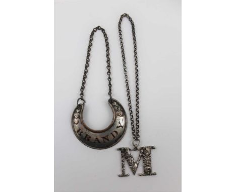 JOSEPH WILLMORE, A GEORGE IV SILVER DECANTER LABEL, an 'M' for madeira, cast with mask decoration on a chain, Birmingham 1826