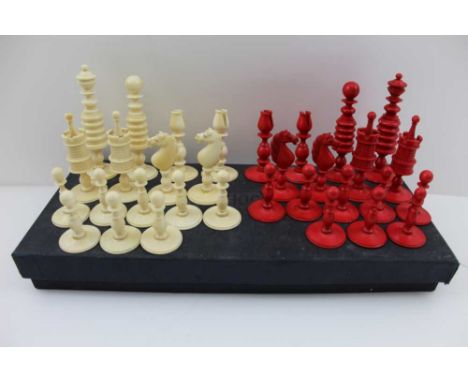 A 19TH CENTURY BARLEYCORN PATTERN IVORY CHESS SET, plain and red stained, the king 10cm high (complete 32 pieces) 