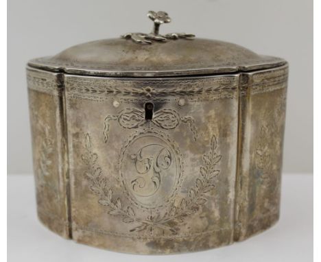 ANDREW FOGELBERG & STEPHEN GILBERT, A GEORGE III SILVER TEA CADDY, oval form, chased ribbon and laurel wreath decoration, the