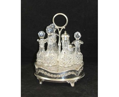 HENRY WILKINSON & CO., A SIX BOTTLE VICTORIAN SILVER BASKET CRUET SET, 1866, oval form with central handle, Sheffield 1866, 2