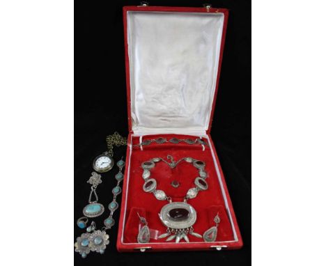 A NORTHERN KASHMIR WHITE METAL TRADITIONAL JEWELLERY SET, comprising necklace, pair of earrings, bracelet, agate set in a red