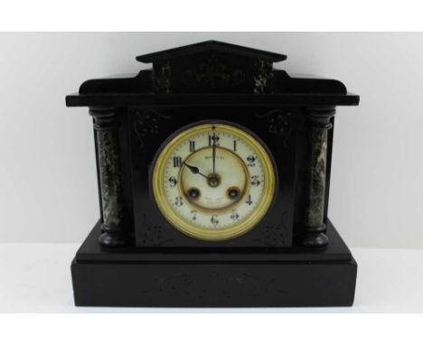 A LATE VICTORIAN BLACK SLATE &amp; MARBLE ARCHITECTURAL CASED MANTEL CLOCK, circular dial with Arabic numerals. inscribed 'Ma