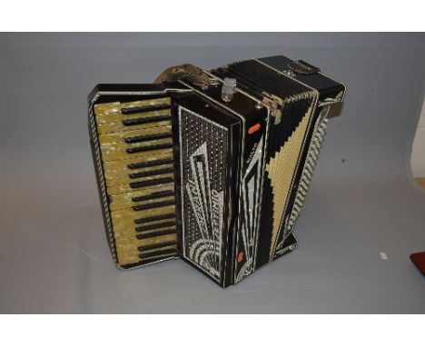 A SOPRANI SETTIMIO RIALTO PIANO ACCORDIAN, in black and cream with crystal inserts, one key is partially missing its mother o