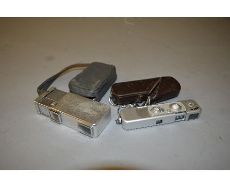 A MINOX COMPLAN SUB MINIATURE CAMERA, with its original leather case and strap and a Minolta 16 Miniature camera in its origi