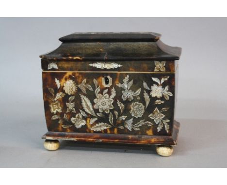AN EARLY VICTORIAN TORTOISESHELL AND MOTHER OF PEARL INLAID TEA CADDY, in need of restoration, two division interior, on bun 