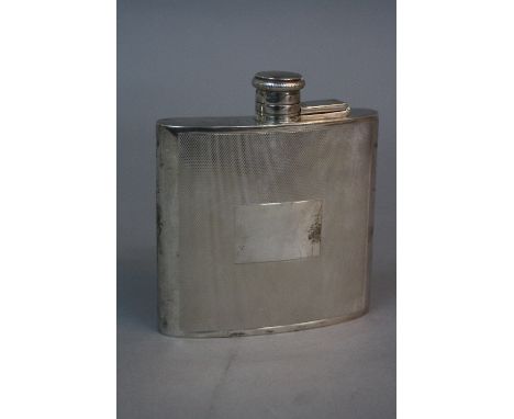 AN ELIZABETH II SILVER HIP FLASK, of concave form, engine turned decoration with vacant rectangular cartouche, maker Laurence