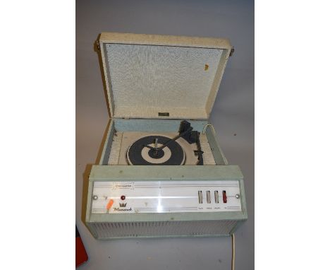 A DANSETTE MONARCH VINTAGE RECORD PLAYER, in pale green and cream case with a silver coloured metal grille to front, fitted w