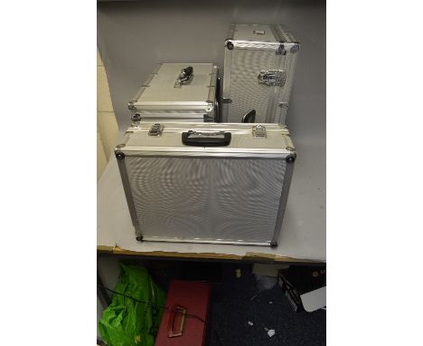 THREE ALUMINIUM CAMERA CASES, of different sizes and shapes