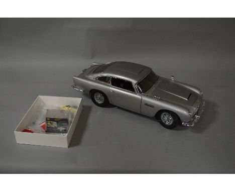 AN EAGLEMOSS JAMES BOND ASTON MARTIN D.B.5, heavy, well built 1;8 scale model constructed with parts from weekly partwork mag