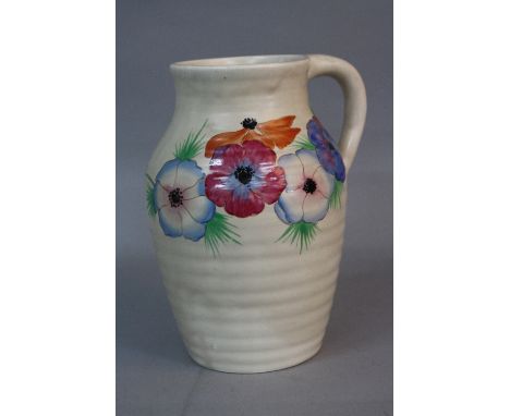 A CLARICE CLIFF ISIS JUG, mushroom ground painted with 'Anemone' flowers, drilled hole towards base to convert to lamp, print