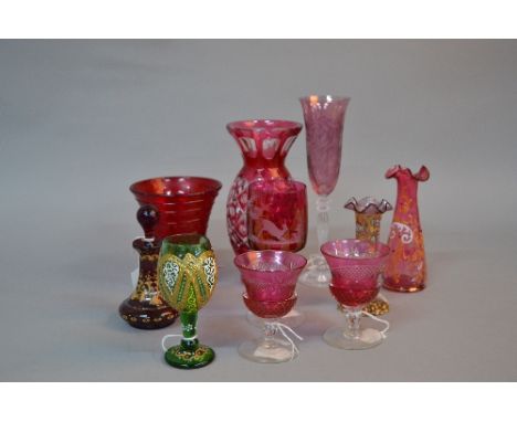 A COLLECTION OF LATE 19TH CENTURY AND 20TH CENTURY CRANBERRY AND RUBY COLOURED GLASS, including drinking glasses, vases, etc,