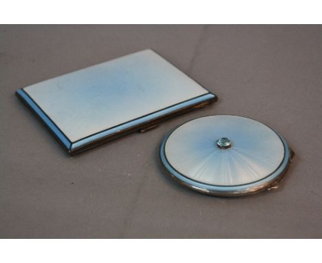 A MATCHING GEORGE VI SILVER AND TWO TONE BLUE ENAMEL POWDER COMPACT AND CIGARETTE CASE, the circular compact with central blu