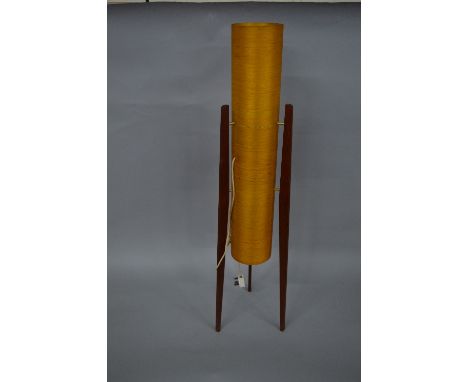 A 1960'S FLOORSTANDING 'ROCKET LAMP', yellow fibreglass shade (split horizontally), on three teak legs, height approximately 