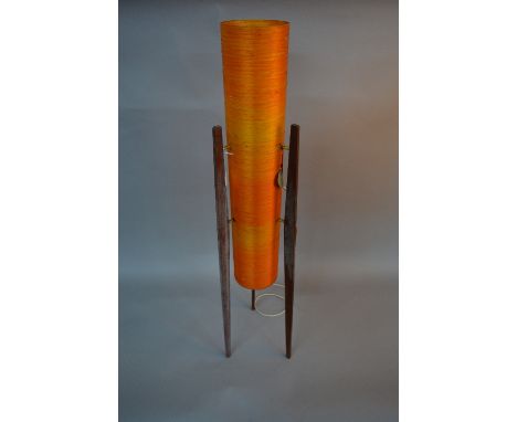 A 1960'S FLOORSTANDING 'ROCKET LAMP', two tone orange fibreglass shade on three 'Burma Teak' legs, with original swing tag, h