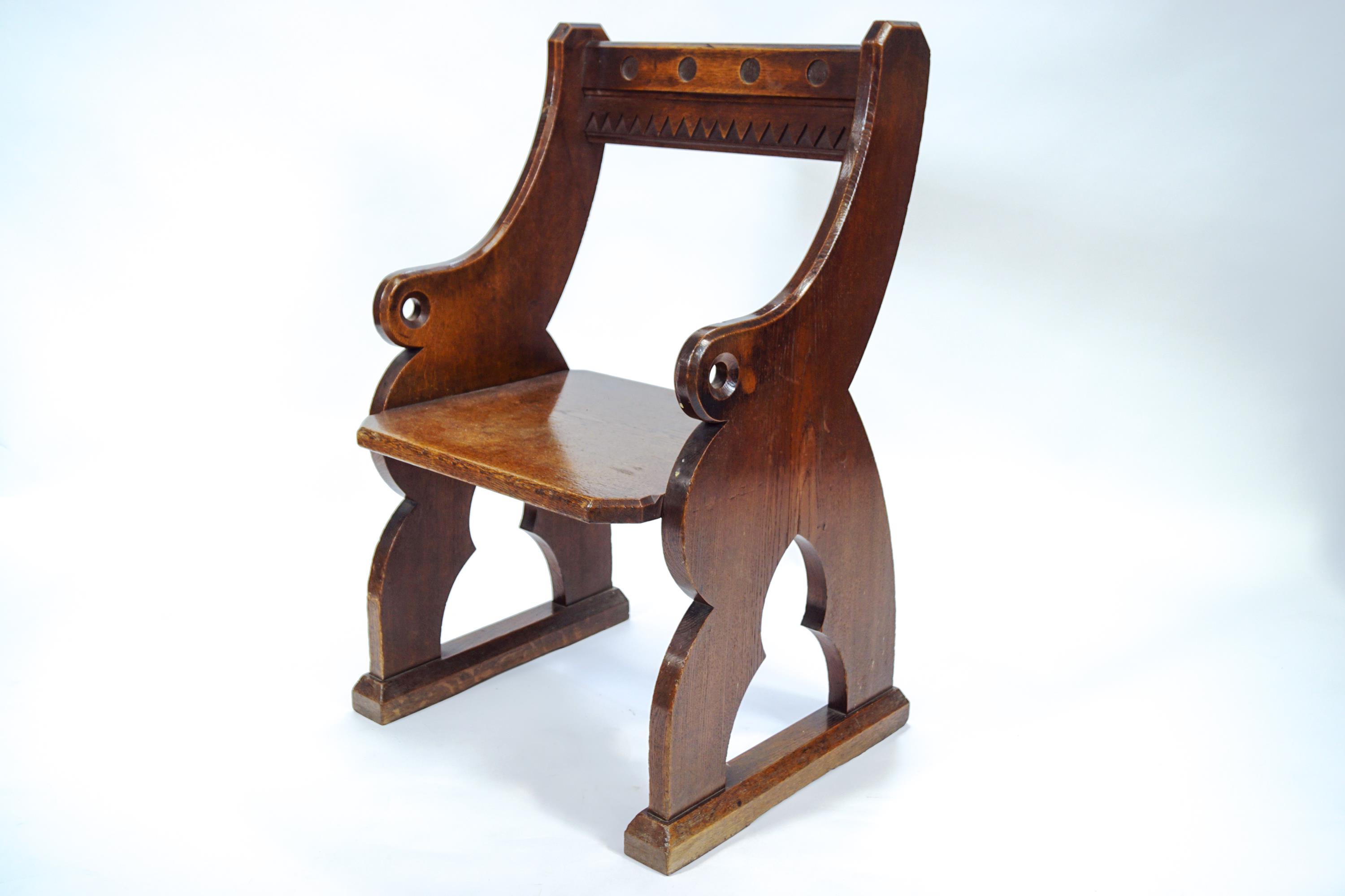 A 19th century oak Priest's sanctuary chair in the Gothic style, of