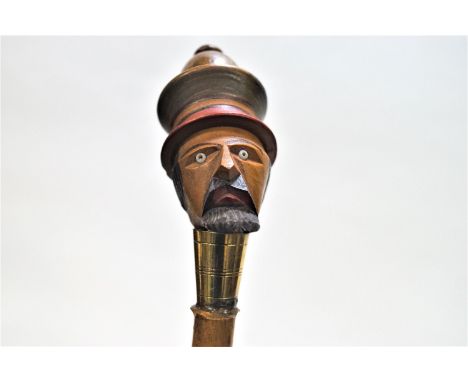 A walking stick, the knop being a gentleman's head, 88cm tall