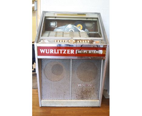 A Wurlitzer 'Hi Fi Stereo' Juke box in a chrome and glass finish, the speaker base marked "Lyric" c1960 containing a selectio