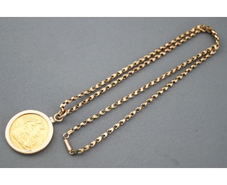 A yellow gold full sovereign dated 1911 in a 9ct gold mount and suspended from a 9ct gold chain. 16.8 grams