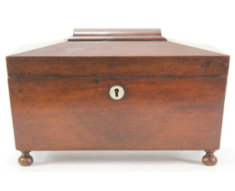 A Victorian mahogany tea caddy, of sarcophagus form (lacking mixing bowl) on turned feet, 33cm wide