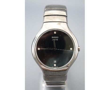 A ceramic Rado DiaStar jubilee wristwatch with titanium clasp. Black dial with diamond dot markers to 12, 3, 6, 9 together wi