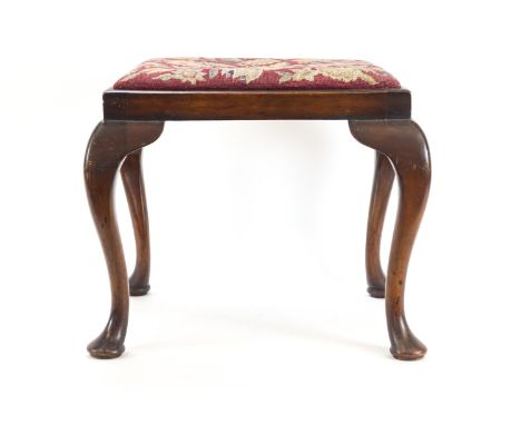 An 18th century style mahogany dressing table stool with drop in tapestry seat raised on flour cabriole legs, 47cm high x 53c