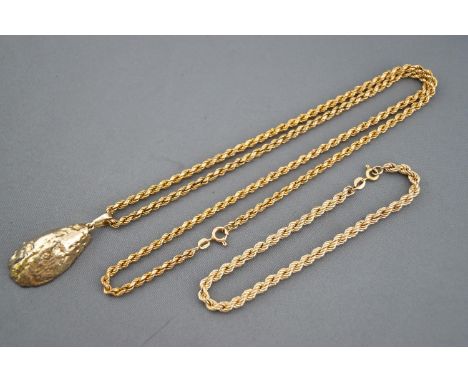 A yellow metal geode crystal pendant (gold plated) suspended from a hallmarked 9ct gold rope chain; together with a hallmarke