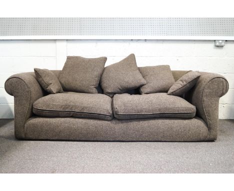 A hand made Conran design sofa, of large proportions with rolled back and arms with two seat cushions and a selection of scat