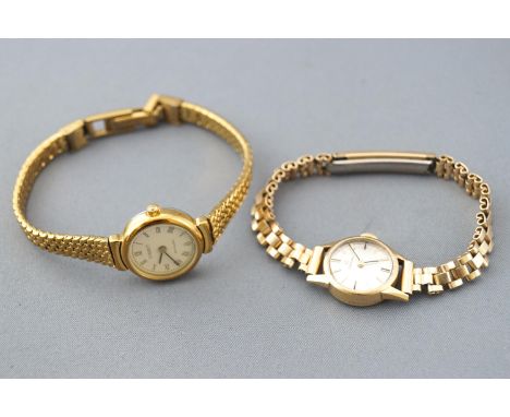 A collection of two wristwatches consisting of a hall marked 9ct gold Omega watch, mechanical movement, with fitted rolled go