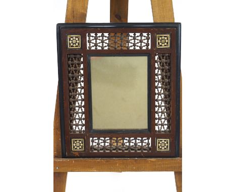 Two Moroccan style frames inlaid with ebony mother of pearl and bone, with turned interlocking bead panels, 52cm wide x 58cm 