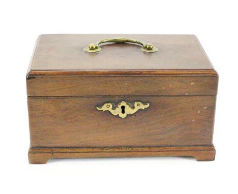 A George III mahogany tea caddy with brass swing handle and a brass escutcheon on bracket feet, 22cm wide