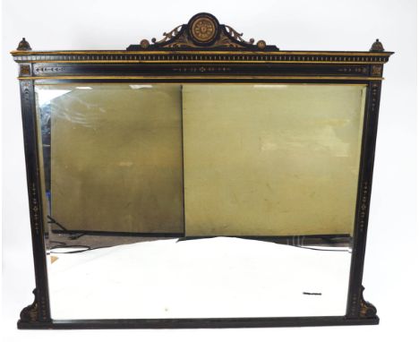 An ebonised over mantel of large rectangular proportions and highlighted with gilt detailing, the top set with a floral motif