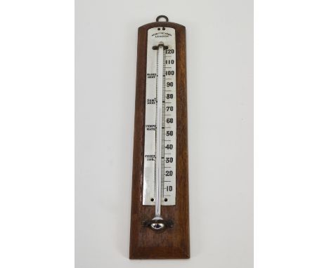 A Negretta and Zambra thermometer with enamel back plate inset into mahogany frame, overall 31cm high