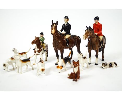 A Beswick china hunting group, comprising three riders, five hounds and the fox, together with two hounds of different manufa