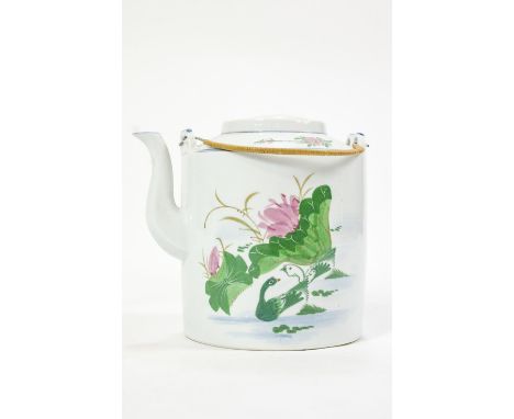 A Chinese porcelain teapot of large form, the plain cylindrical body decorated with floral sprigs and suspended from two bamb