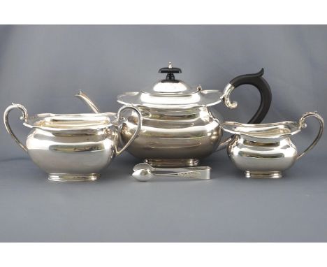 A silver tea service of shaped rectangular form with domed lid over an eight sided top and a bombe body on a plain foot, set 