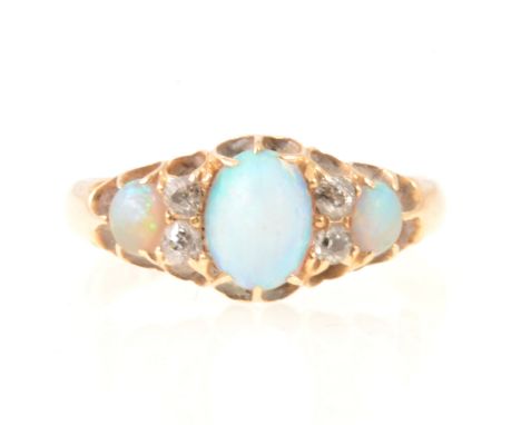 A Victorian opal and diamond half hoop ring, three graduated oval cabochon cut opals claw set and spaced by two pairs of old 