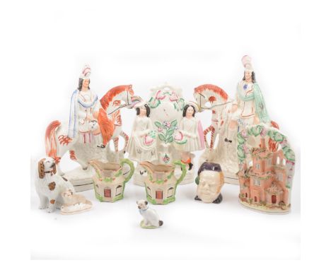 A Staffordshire flatback clock group; large pair of hunters on horseback; small seated Pug; a novelty majolica style inkwell,