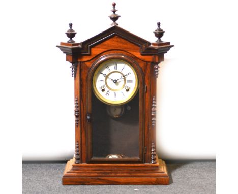 Late 19th Century steeple clock, circular dial, spring driven movement striking on a bell, rosewood case, 60cm.