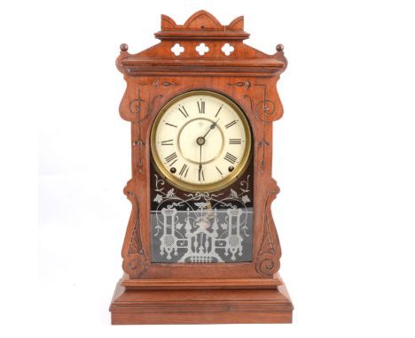 American gingerbread clock, the dial signed for Seth Thomas, the movement striking on a bell and a gong, 46cm.