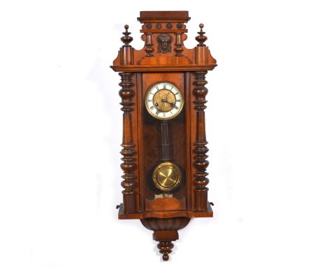 A Vienna style wall clock, walnut and beech case, circular dial, the movement striking on a gong, 89cm.