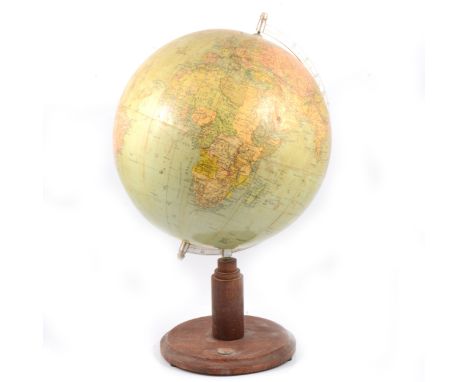 A 1940s / 1950s globe, on wooden base with integrated compass, unmarked, 52cm high.