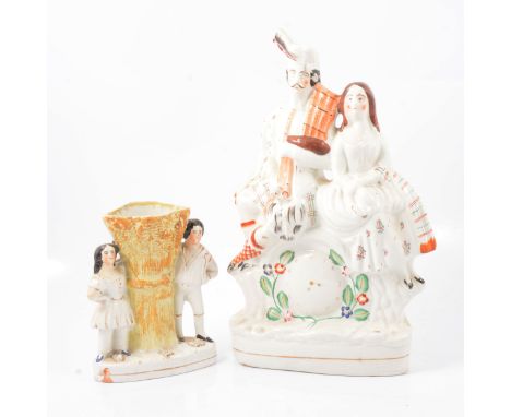 Staffordshire pottery flat back clock group, modelled with a Highlander and his wife, 36cm; and a small collection of Staffor