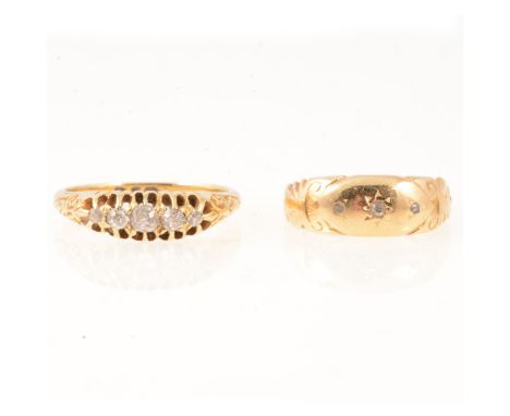 A diamond five stone half hoop ring, the graduated stones claw set in an 18 carat yellow gold mount, engraved scroll shoulder