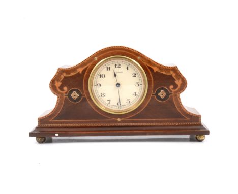Inlaid mahogany 8 day mantel clock, 8.5cm cream dial with arabic numeral chapter ring, shaped case standing on four metal bal