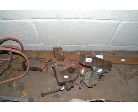 Two bench vices and a woodworking clamp
