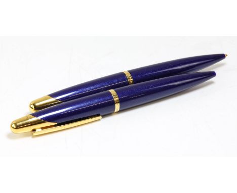 DUNHILL, pen set, gold and blue finish, to comprise ball point pen and propelling pencil, in case with guarantee card and man