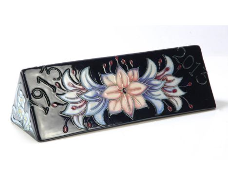 MOORCROFT advertising plaque in a triangular "toblerone" shape (N/PLQ) , measuring 18.5cm in length and to the base 6cms in d